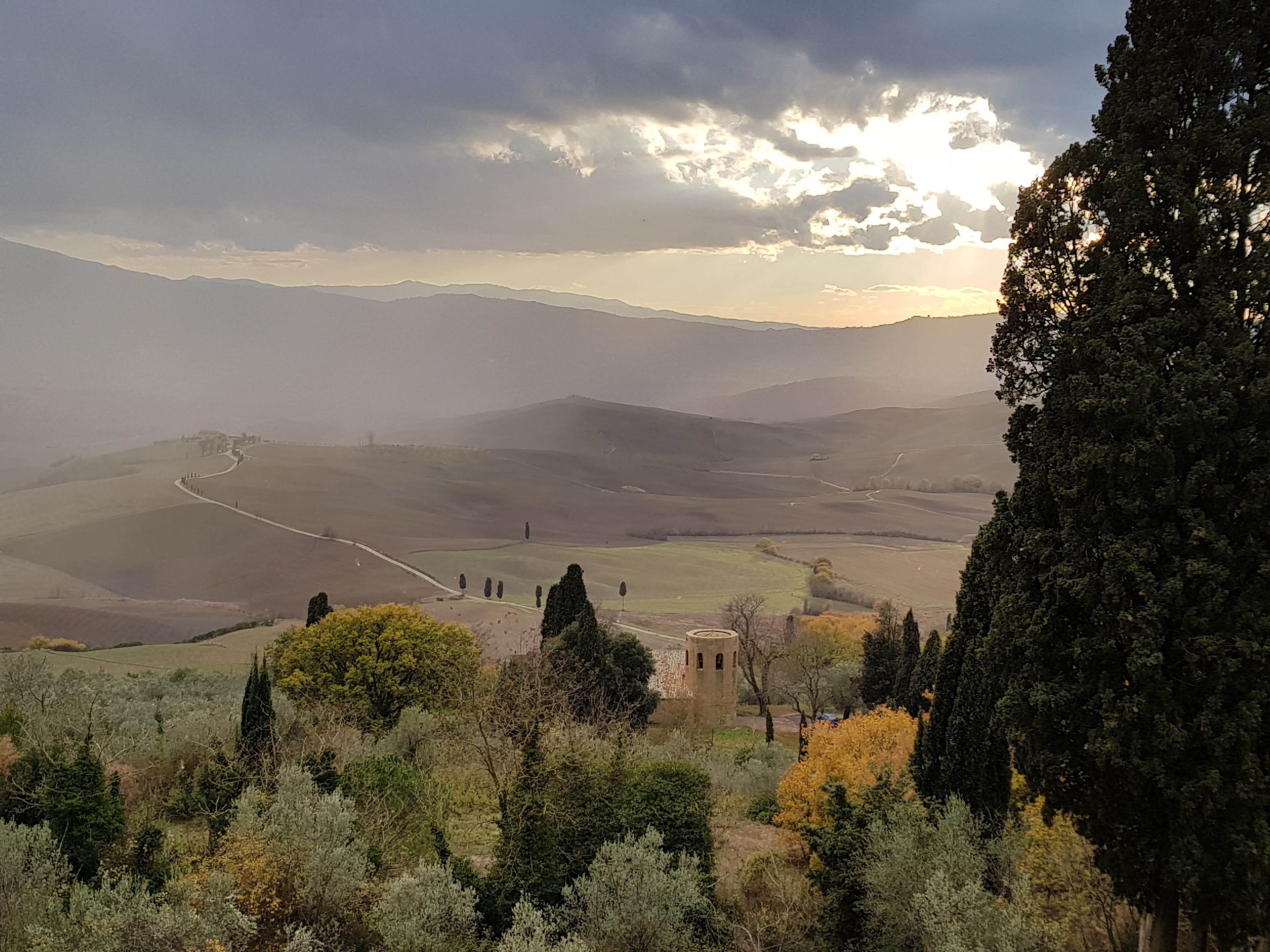 Pieve di Corsignano surrounded by Val d'Orcia fields