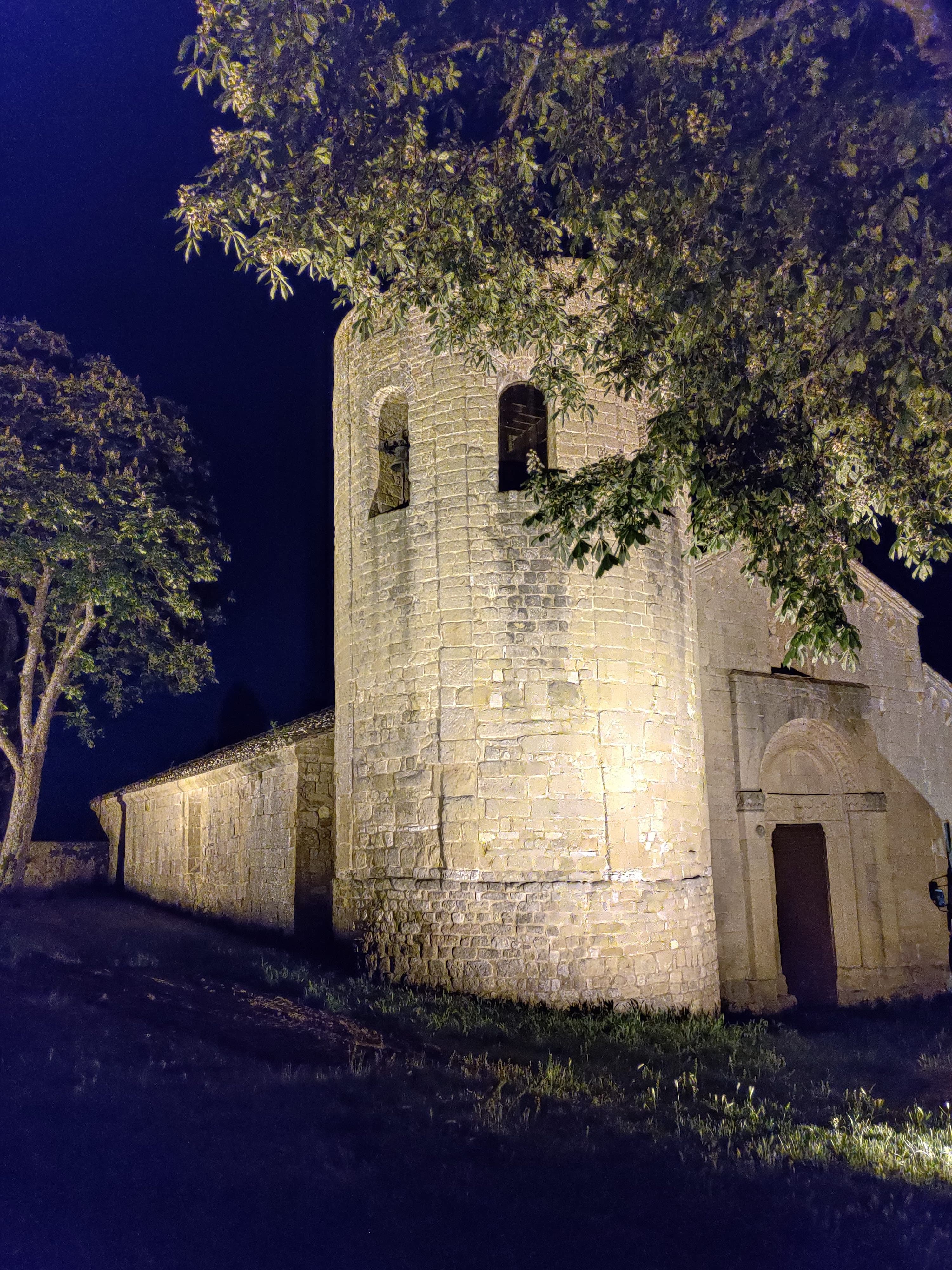 Pieve di Corsignano at night — starlit Romanesque church